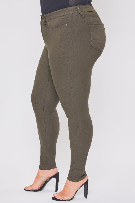 Olive green pants worn by a person on a white background