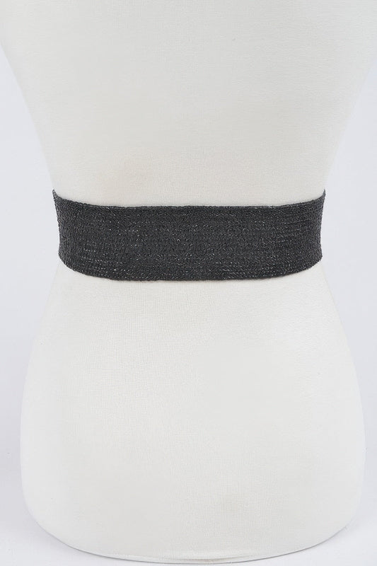 Black belt on a mannequin bust against a white background