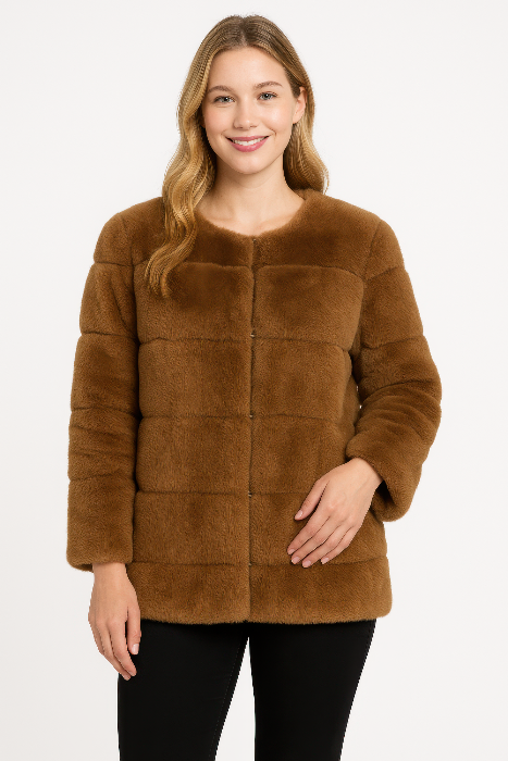 Woman wearing a brown faux fur jacket on a white background