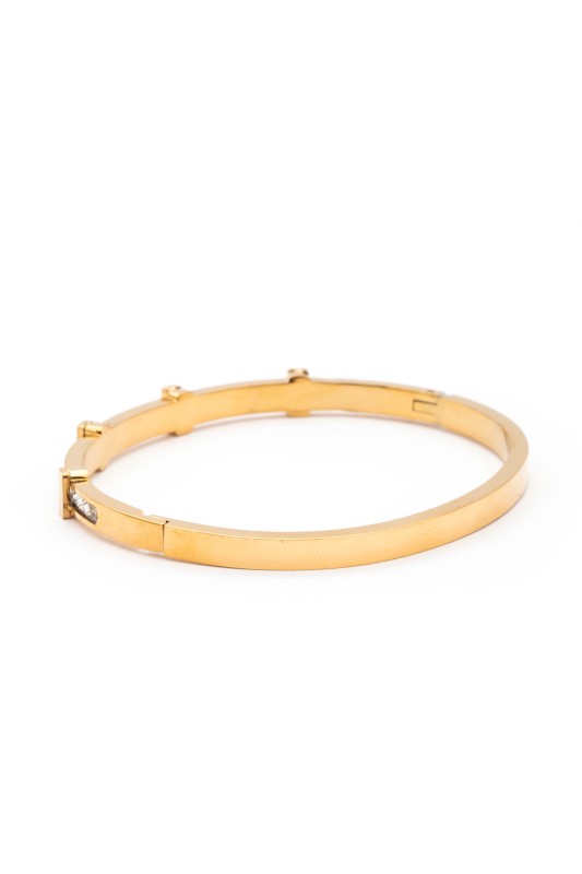 Gold bracelet on a white background