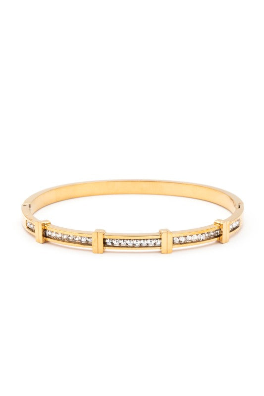 Gold bracelet with embedded stones on a white background