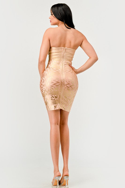 A model wearing a gold, strapless, mini dress with sequins and bead embellishments, featuring a sweetheart neckline.