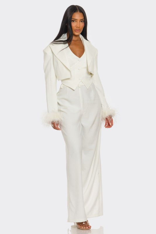 Woman wearing a white suit on a white background