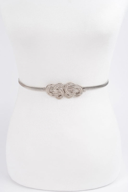 Silver belt with intricate design on a white background
