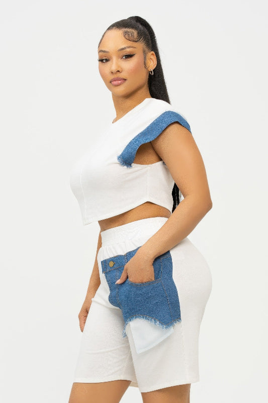 side view of Woman wearing a white outfit with blue accents on a white background