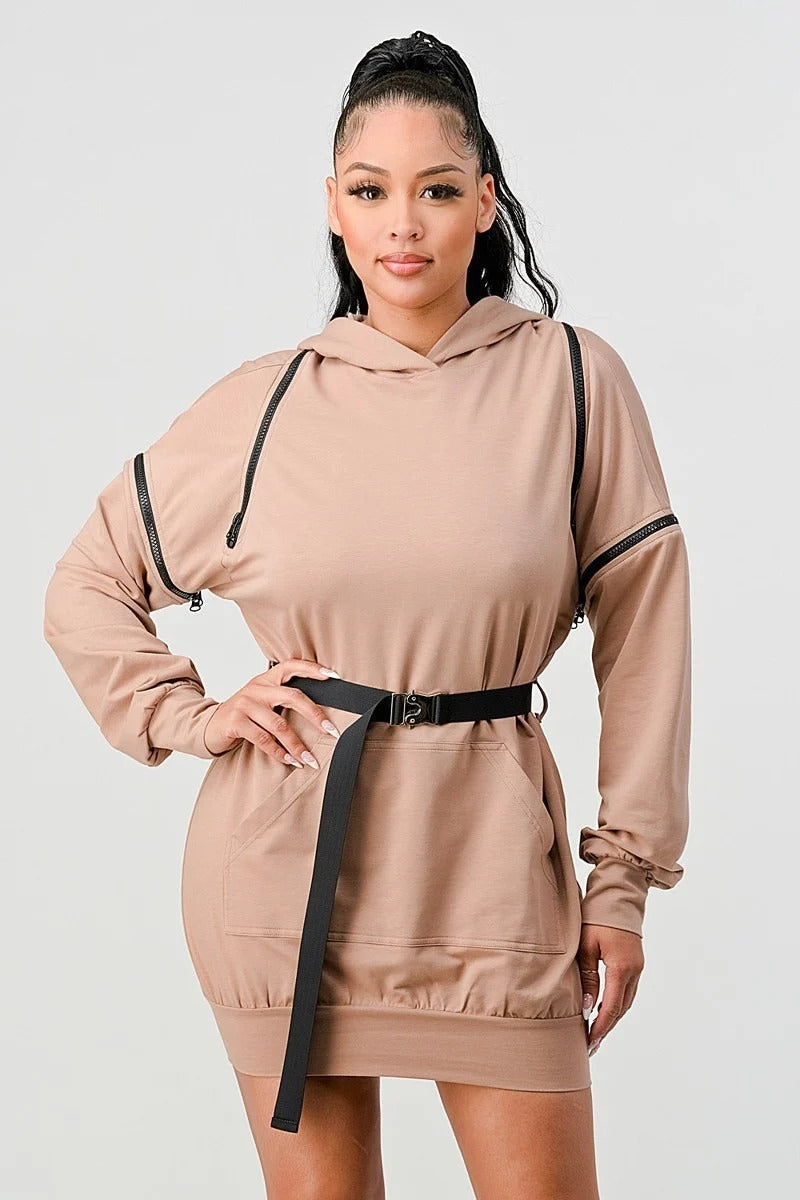DOUBLE ZIPPER LONG SLEEVE HOODED MINI DRESS WITH AN ACCENT BELT + POCKET DETAILS. (SLEEVE ZIPPERS ARE DETACHABLE)