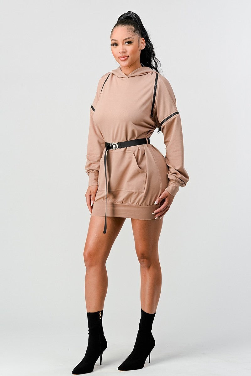 DOUBLE ZIPPER LONG SLEEVE HOODED MINI DRESS WITH AN ACCENT BELT + POCKET DETAILS. (SLEEVE ZIPPERS ARE DETACHABLE)