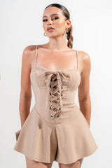 close up view of light brown stretch woven Stretch Lace Up Romper