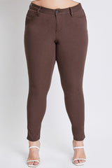 Brown pants worn by a person on a white background