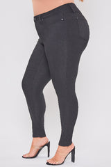 Black pants worn by a person on a white background