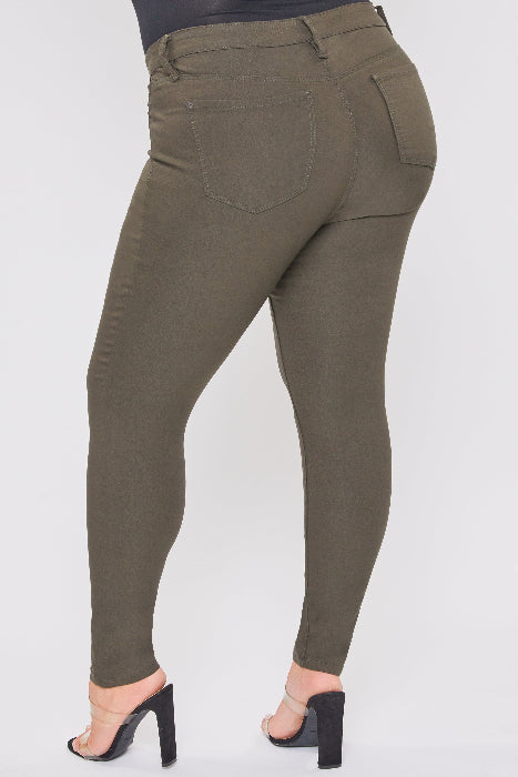 Olive green pants worn by a person on a white background