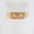 Beige woven belt with gold accents on a mannequin against a white background