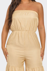 Beige strapless jumpsuit worn by a person on a white background