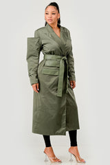 Woman wearing a green trench coat on a white background