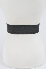 Black belt on a mannequin bust against a white background