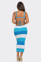 back view of a Woman wearing a blue and white striped dress on a white background