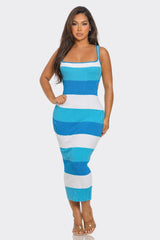 Woman wearing a blue and white striped dress on a white background