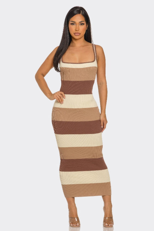 Woman wearing a brown striped dress on a white background