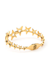 Gold star-shaped bracelet on a white background