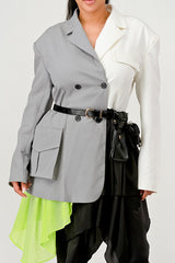 close up of model wearing Grey and White Colorblock Blazer with Layered Neon Green and Black Skirt Detail – Avant-Garde Statement Jacket