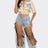 model wearing faux leather beige top with cut out denim pants front view