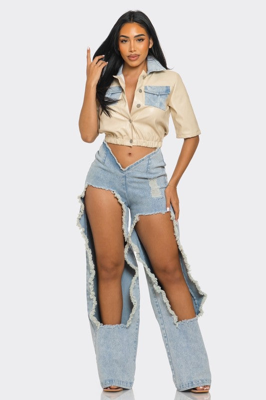 model wearing faux leather beige top with cut out denim pants front view