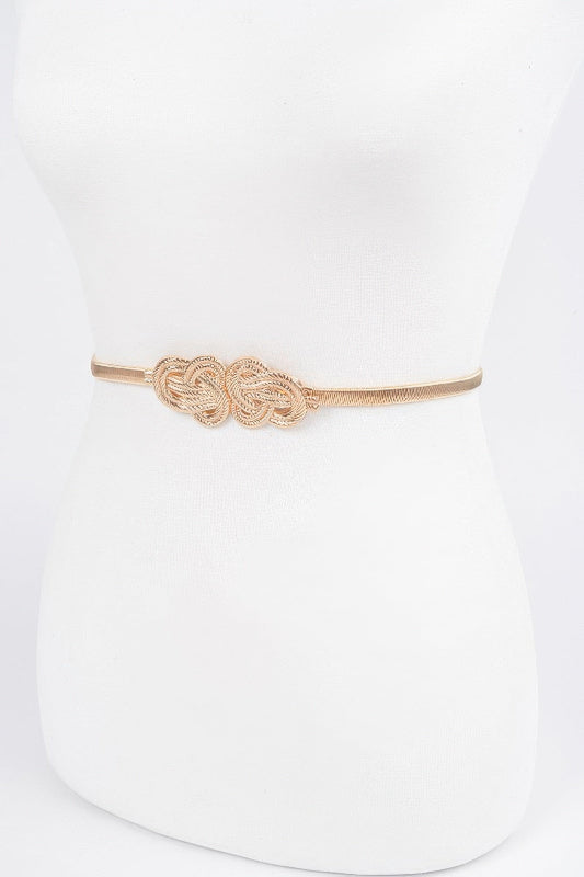 Gold belt with a decorative knot on a white background