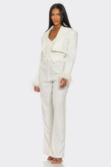Person wearing a white suit on a white background