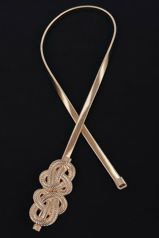 gold belt with intricate design on a black background