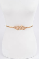 Gold belt with a knot design on a white mannequin.