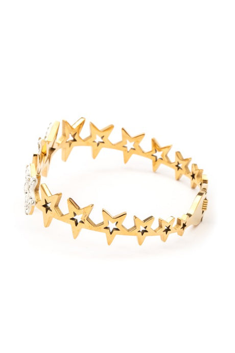Gold star-shaped bracelet on a white background