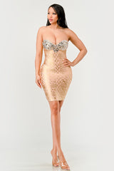 full body view of A model wearing a gold, strapless, mini dress with sequins and bead embellishments, featuring a sweetheart neckline.