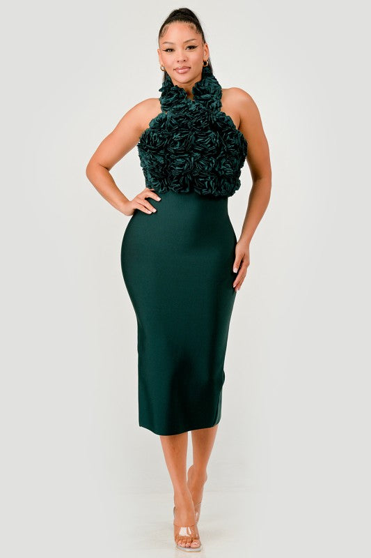 Woman wearing a green dress with a floral top on a white background