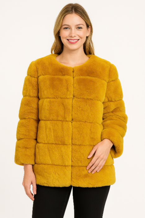 Woman wearing a mustard yellow fur coat on a white background