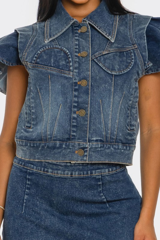 Denim vest worn by a person on a white background