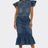 Woman wearing a denim outfit with a top and skirt on a white background