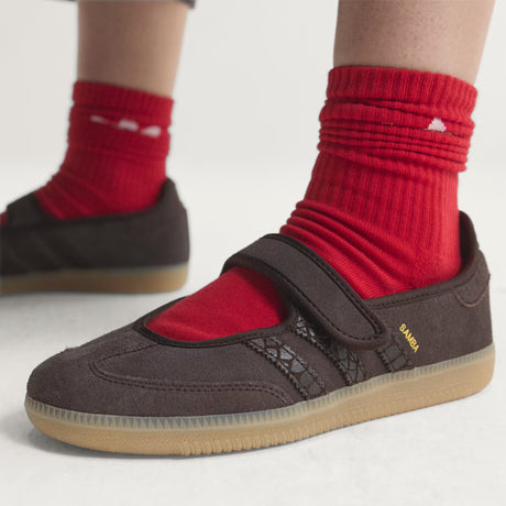 Brown Adidas Samba Jane Mary Jane Sneakers with red socks on a light background