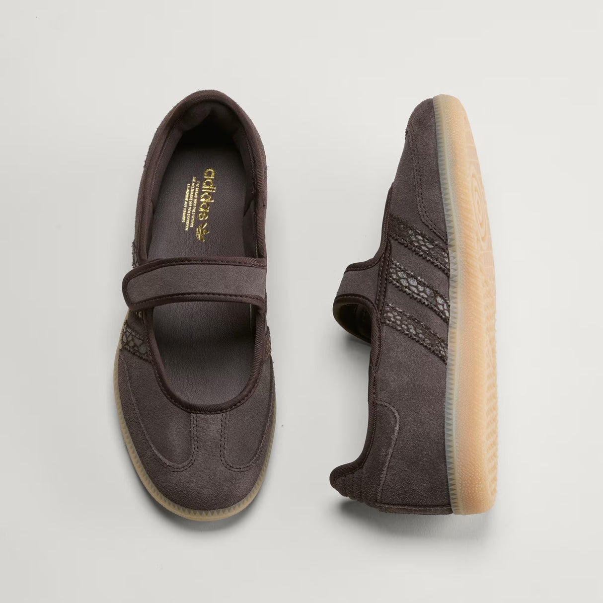 Pair of brown Adidas Samba Jane Mary Jane Sneakers with a visible brand logo on a light gray background