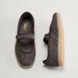 Pair of brown Adidas Samba Jane Mary Jane Sneakers with a visible brand logo on a light gray background