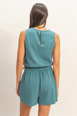 Teal Drawstring Waist Sleeveless Romper on a beige background