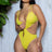 Woman wearing a yellow swimsuit against a light wooden panel background