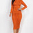model wearing orange Long Sleeve Ruched Midi Dress
